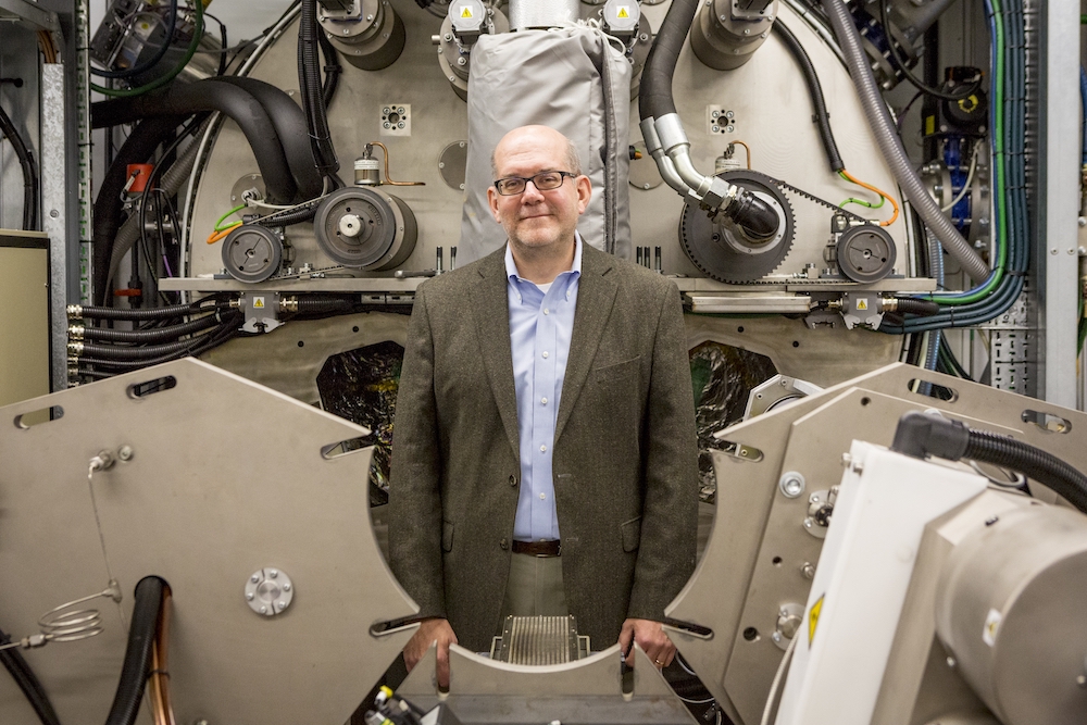 Mark Poliks, director of CAMM, posed at the back of the General Vacuum Equipment tool.