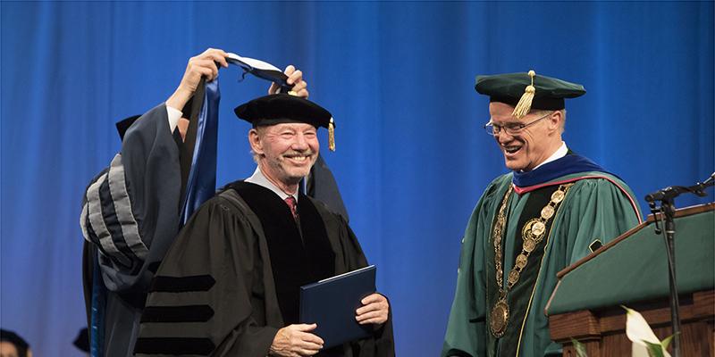 Three alumni will receive honorary degrees at the 2018 Graduate School Commencement ceremony at 4 p.m. Friday, May 18, in the Events Center. Here, Tony Kornheiser '70, is shown receiving his honorary degree in 2017.