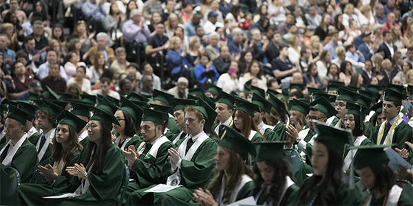 Students applaud during a 2017 Harpur College of Arts and Sciences Commencement ceremony.