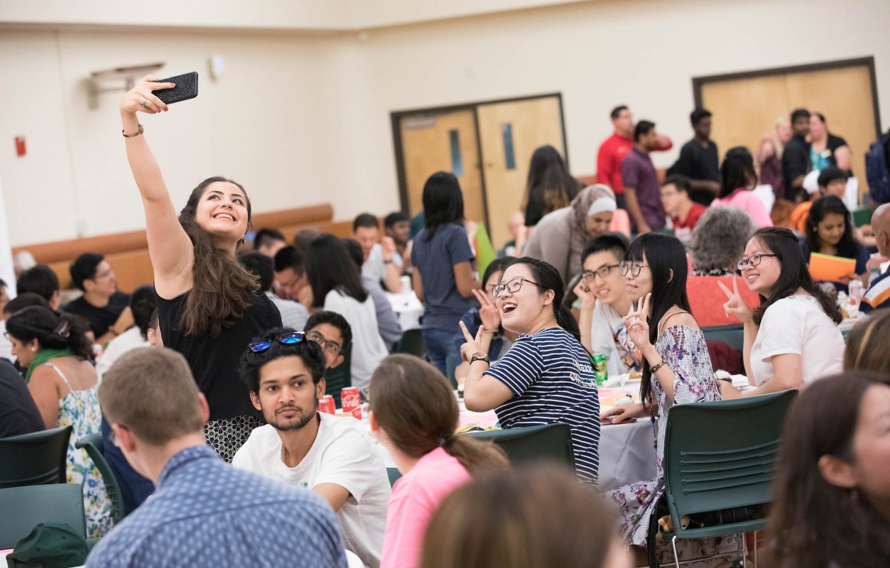 Ghazal Mohsenian, MS '20, PhD '22, snaps a photo of friends she made at the New International Student Welcome Picnic in 2017. Mohsenian credits the help of the International Student and Scholar Services and others at Binghamton University and Watson College for making her education possible.