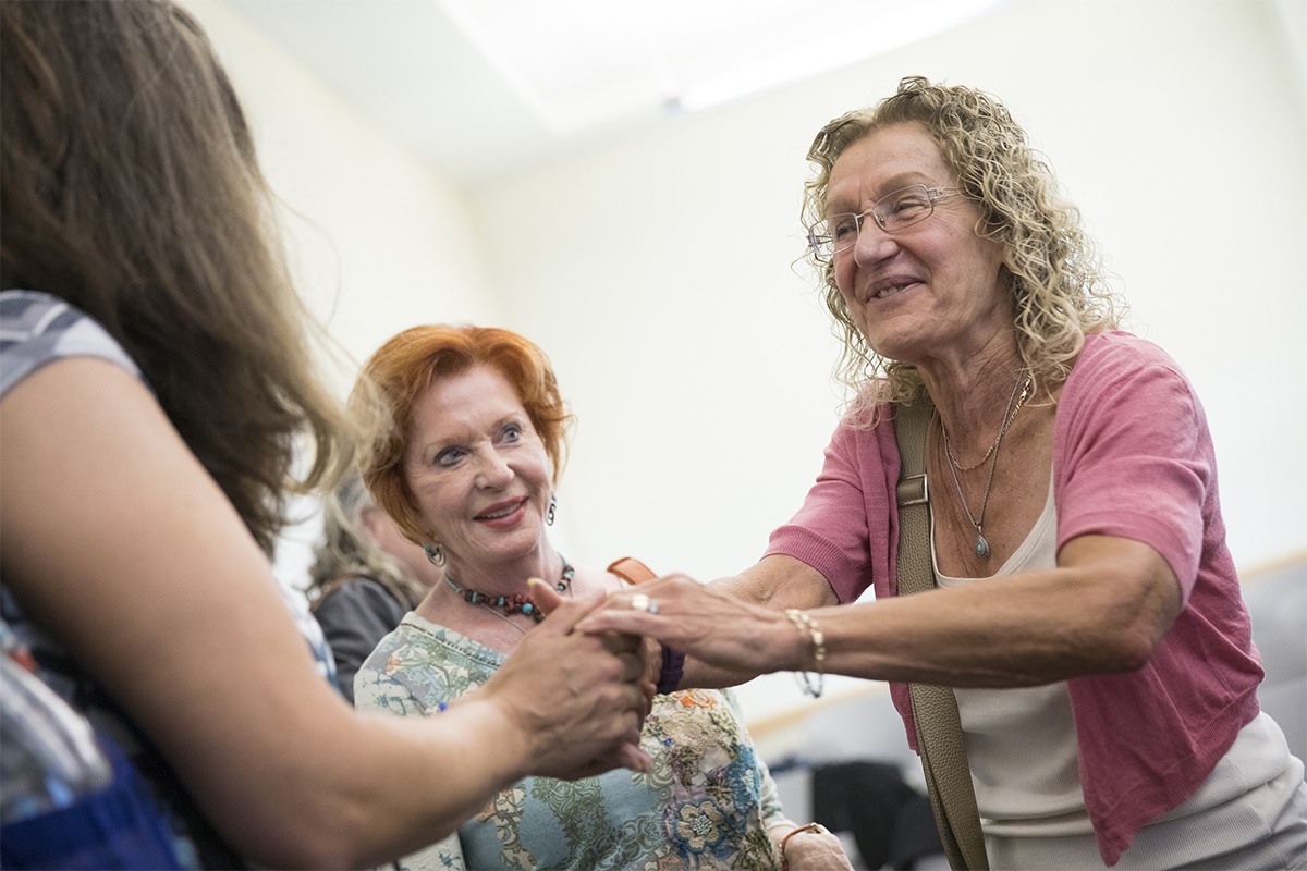 Jean Quataert, newly appointed distinguished professor of history, greets former students who returned to campus to attend and present at her retirement symposium held in September 2017.