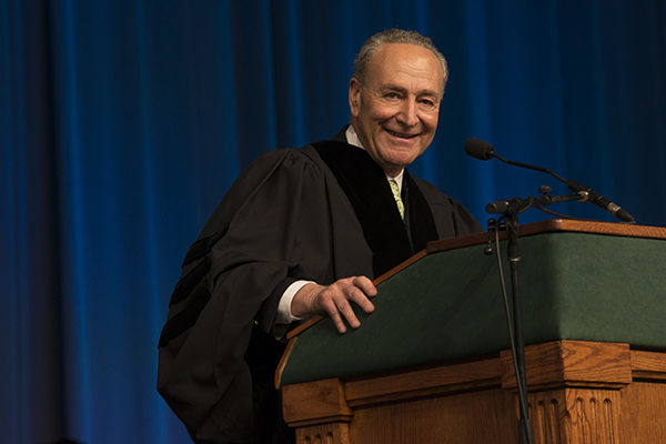 U.S. Sen. Charles Schumer at the podium during Harpur College's morning commencement ceremony.