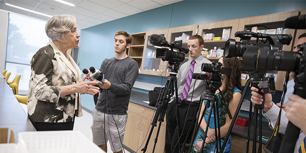 School of Pharmacy and Pharmaceutical Sciences Founding Dean Gloria Meredith speaks to the media on the first day of classes held at the brand-new school.