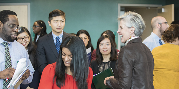 Leigh Briscoe-Dwyer, vice president of network pharmacy at Westchester County Medical Center Health System in Valhalla, N.Y., speaks with PharmD students during the March 29, 2019, Career Fair at the School of Pharmacy and Pharmaceutical Sciences.