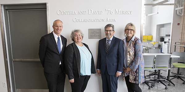 Cynthia and David ’76 Mirsky Collaboration Area dedication at The Koffman Southern Tier Incubator in downtown Binghamton, April 8, 2019, with President Harvey Stenger, Betsy Koffman and the Mirskys posing in front of the new sign.