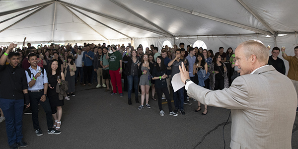 President Harvey Stenger toasts graduating seniors who came out in force for the 2019 Champagne Senior Send-off.