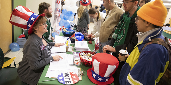 Outside a polling place in Old Union Hall in the University Union, Tamara Lindow, of the Center for Civic Engagement, informs students on Nov. 5, 2019, where they can vote.