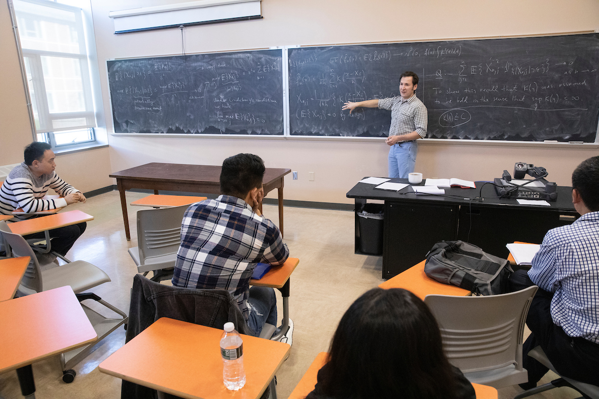 Aleksey Polunchenko, associate professor of mathematics and statistics, teaches a graduate level statistics class at Whitney Hall, Nov. 6, 2019.