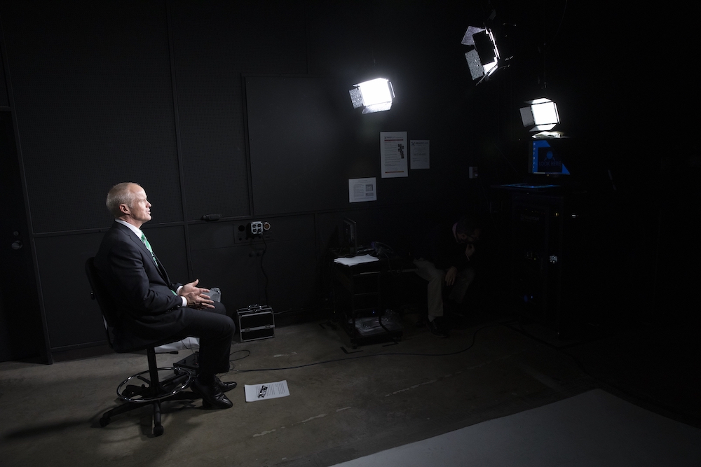 Binghamton University President Harvey Stenger using the ReadyCam system that can livestream high-definition video to network television.