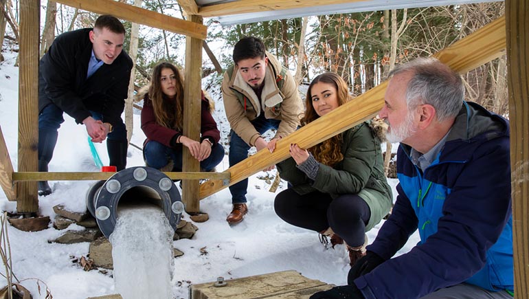 From left, Aaron Spaulding, Kate Boyle, Stephen West, Kayla Hackett and faculty advisor Jack Maynard were part of a electrical and computer engineering capstone project.