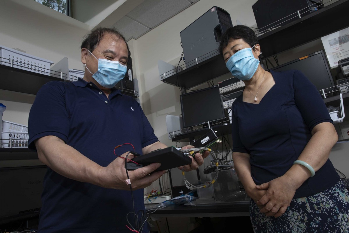 Susan Lu, professor of systems science and industrial engineering and Chuan-Jian Zhong, professor of chemistry, photographed at Zhong’s laboratory in the Smart Energy Building at the Innovative Technologies Complex.
