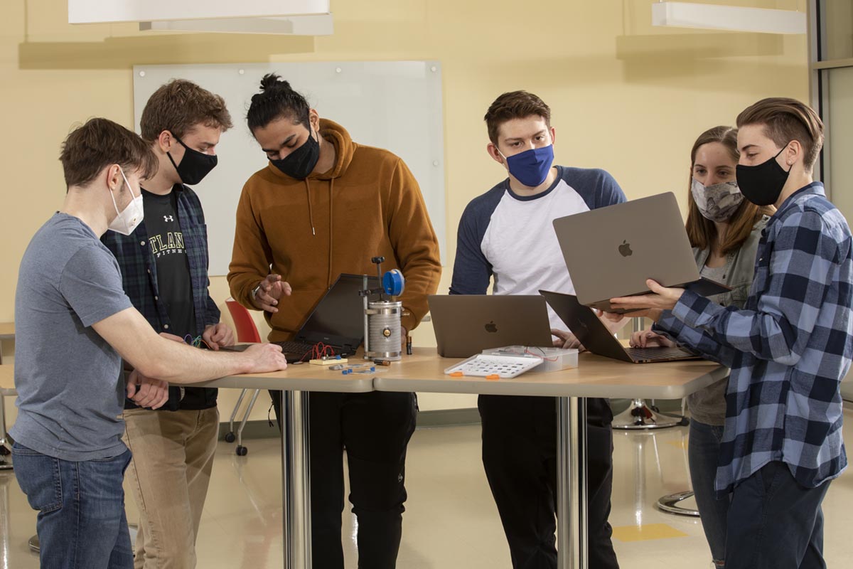 Biomedical engineering students, from left, David Yefroyev, Harry Olszewski, Tavish Srivastava, Andrea Russo, Megan DiBella and Randy Kipnis work together on their senior project.