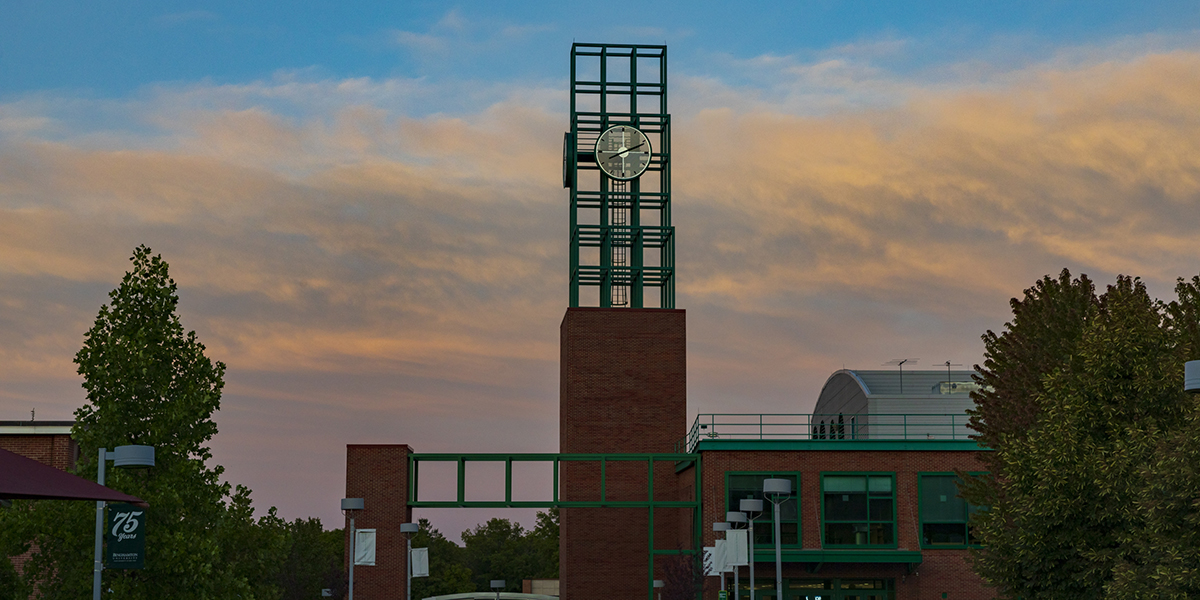 Binghamton University's clock tower atop the University Union, at sunset.