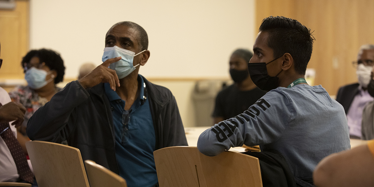 Student Alex Nandalall, right, at the New Student of Color Network event hosted by the Multicultural Resource Center held in fall 2021.