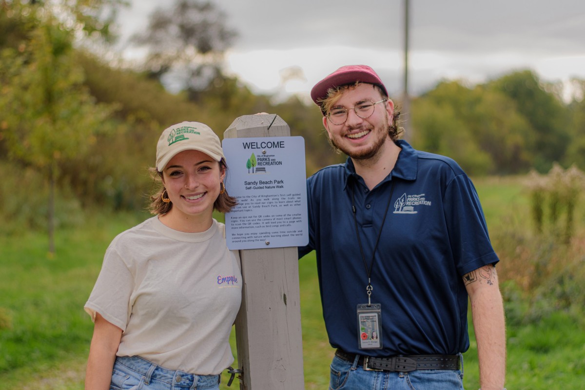 Part-time Parks and Recreation Department employees, and recent Binghamton University alumni, Cam Winzinger and Anna Shaheen, pictured here, Oct 7, 2021, are spearheading the efforts to establish the City of Binghamton’s first educational nature trail at the 16-acre Sandy Beach Park at 545 Conklin Ave. on Binghamton’s South Side. The Sandy Beach Park Nature Trail will repurpose an underutilized softball field and crumbling basketball court. The trail will feature three pollinator gardens, bird and bat boxes, bee hives, new tree plantings and informational signage on conservation, pollination, endangered and invasive species, and trees and birds seen in the park.