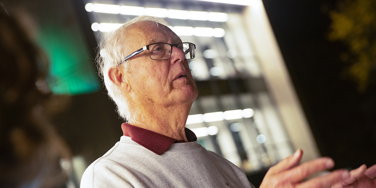 Al Vos, the former collegiate professor of Hinman College until he retired in 2020, speaks with students at n the new Hinman College Dining Hall during Homecoming Weekend, Saturday, Oct. 9, 2021.
