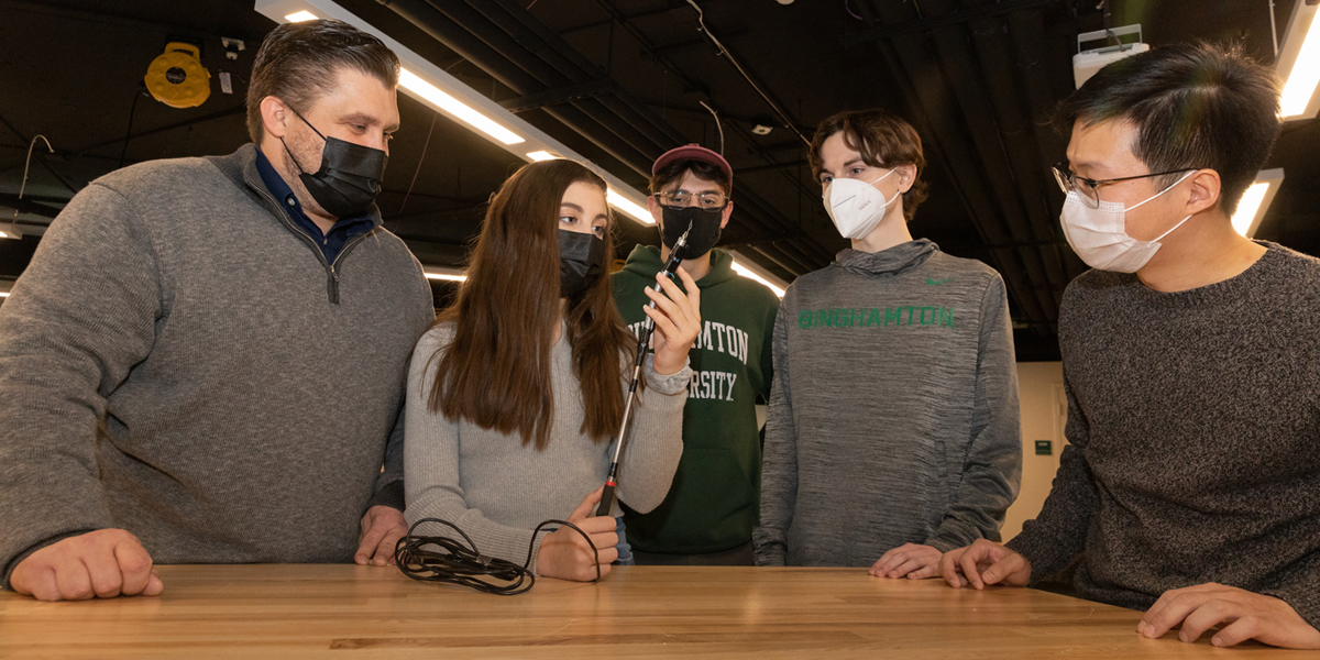 At the Fabrication Lab in the Engineering Building, 11-year-old Delaney Dixon, a sixth-grade student at Windsor Middle School, and her father, Chris Dixon, met with Thomas J. Watson College of Engineering and Applied Science mechanical engineering students Salvatore Mezzatesta, Justin Adamczak and Jung Wok Oh. The students worked with Delaney to develop the Tick Stik, a device to help check for ticks. Delaney thought of the idea after battling Lyme disease from a tick bite.