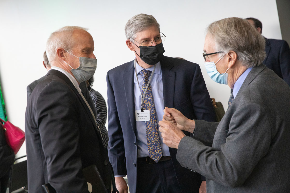 From left, Binghamton University President Harvey Stenger, NY-BEST Consortium Executive Director William Acker and Distinguished Professor M. Stanley Whittingham chat during the New Energy New York coalition meeting Thursday.