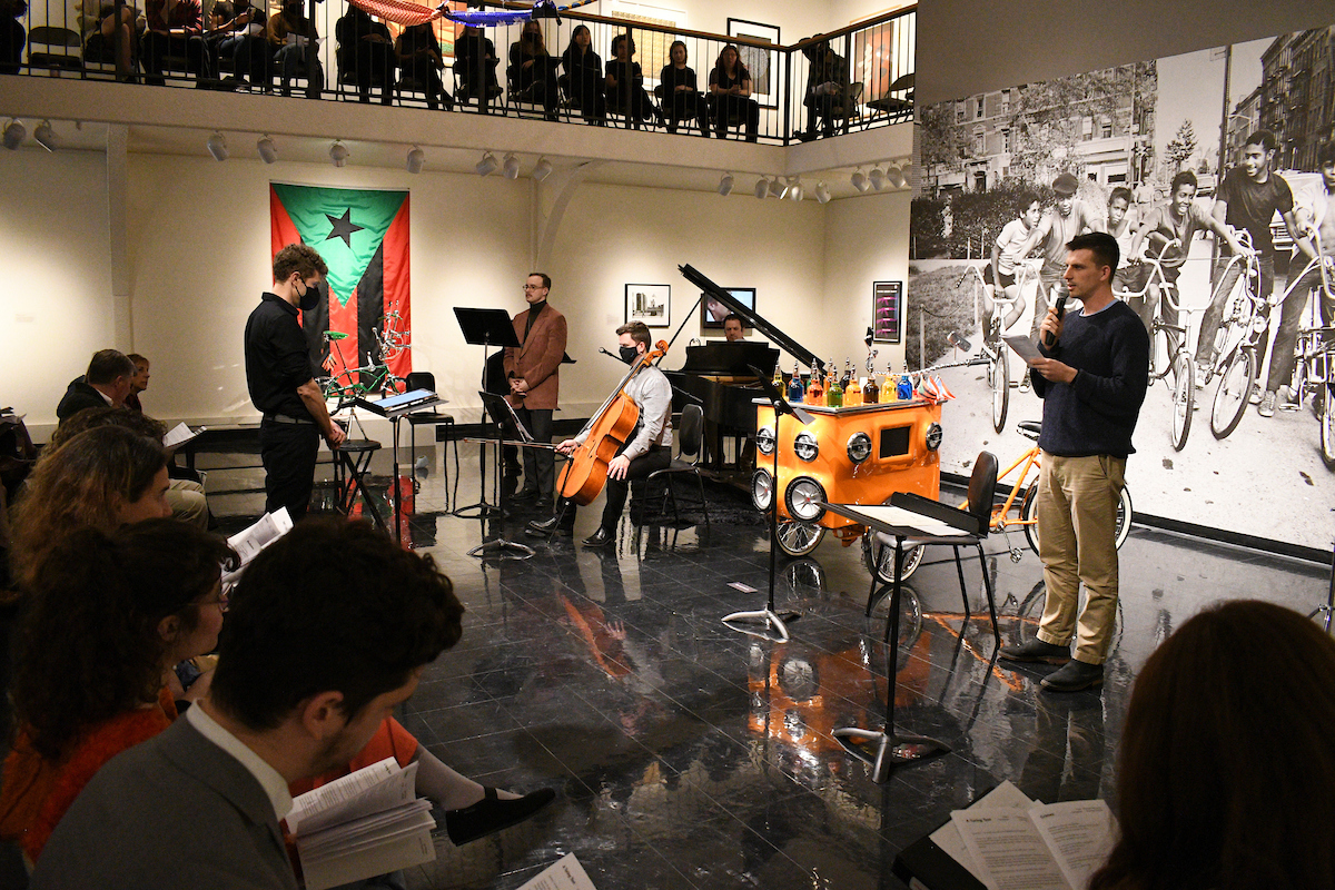 Pictured here, students and faculty members, including tenor Lex Bonner (far left) and poet Cole Depuy (far right) perform 