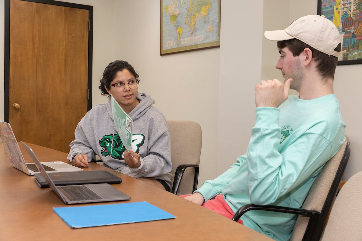 Undergraduates Trevor Fornara and Briana Lopez-Patino edit a politicial science publication, 