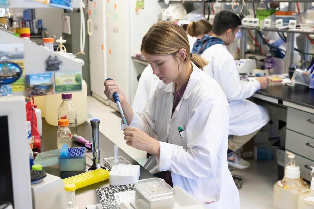Student Kylie Purkeypile conducts research in the Biotechnology Building's biofilms lab as part of the National Science Foundation - Research Experiences for Undergraduates program on July 21, 2022.