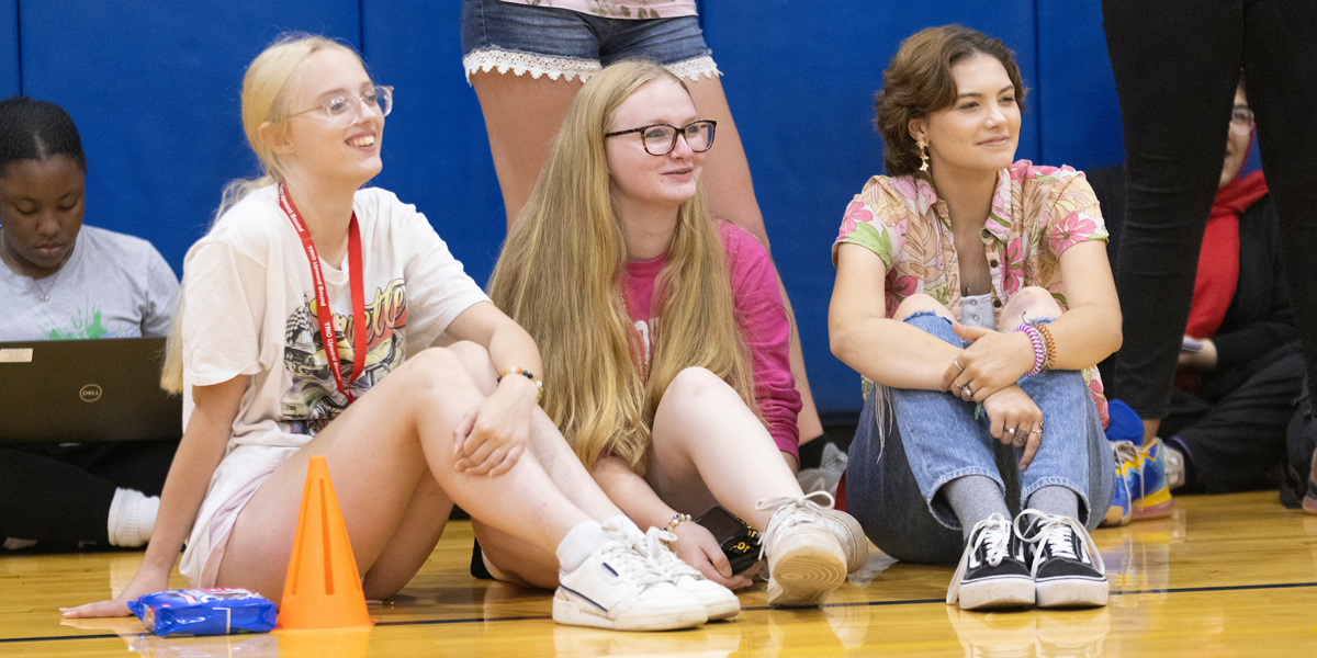 Students in the Upward Bound (UB) summer program, including Molly Barnes, right, and members of the New York State University Police participate in UB Olympics, a series of events which was held at the East Gym on Aug. 4, 2022.