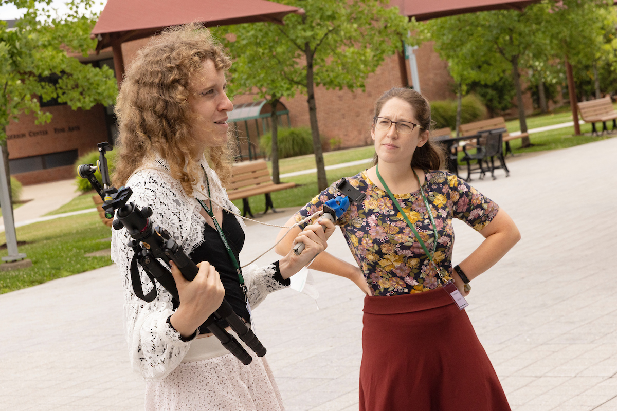 Graduate student Theresa Kadish (left) and Chelsea Gibson (right), director of the Binghamton Codes! Program, teach a workshop on making TikTok videos on Aug. 9, 2022.