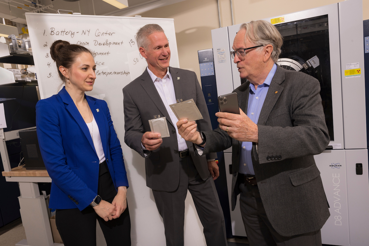 Olga Petrova, left, director of the Office of Entrepreneurship and Innovation Partnerships, talks with Per Stromhaug, associate vice president for innovation and economic development, center, and Nobel laureate M. Stanley Whittingham in a chemistry lab at Binghamton’s Innovative Technologies Complex. The trio are among the key organizers of the New Energy New York project.