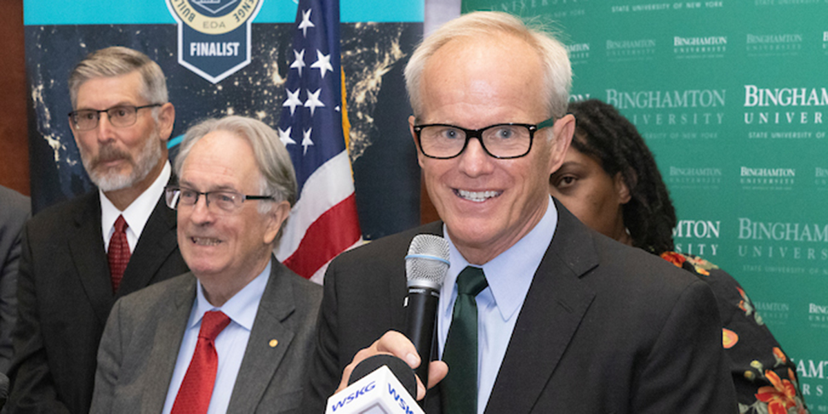 President Harvey Stenger, with Distinguished Professor and Nobel Laureate M. Stanley Whittingham at his right, were joined by partners at the Build Back Better Regional Challenge announcement in August.