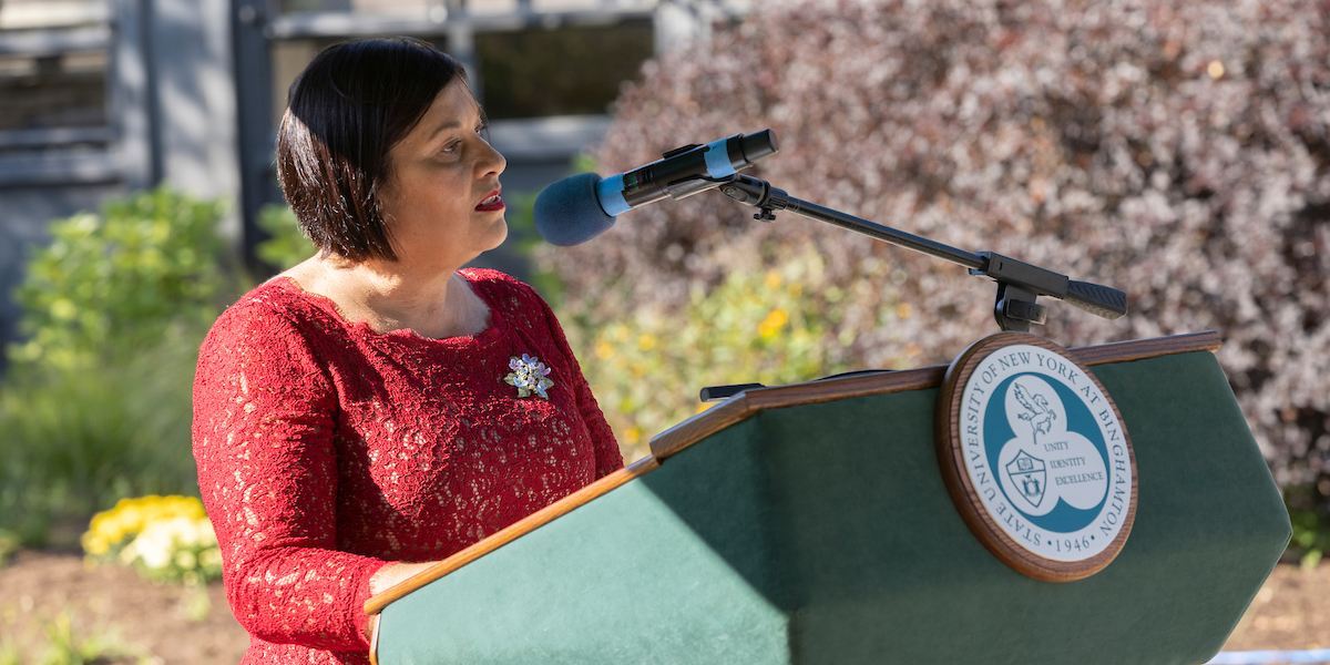 Lorena Aguilar, executive director of the Ellyn Uram Kaschak Institute for Social Justice for Women Girls, speaks at the ceremoney where Kaschak was awarded the University Medal, Sept. 15, 2022.