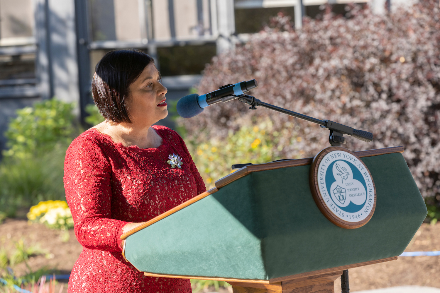 Lorena Aguilar, executive director of the Ellyn Uram Kaschak Institute for Social Justice for Women Girls, speaks at the ceremoney where Kaschak was awarded the University Medal, Sept. 15, 2022.