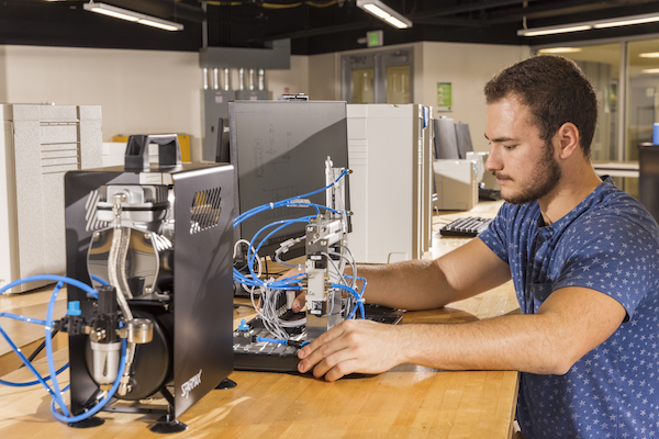 Systems Science and Industrial Engineering undergraduate Justin Rutley at the Advanced Manufacturing Lab in the Engineering Building.