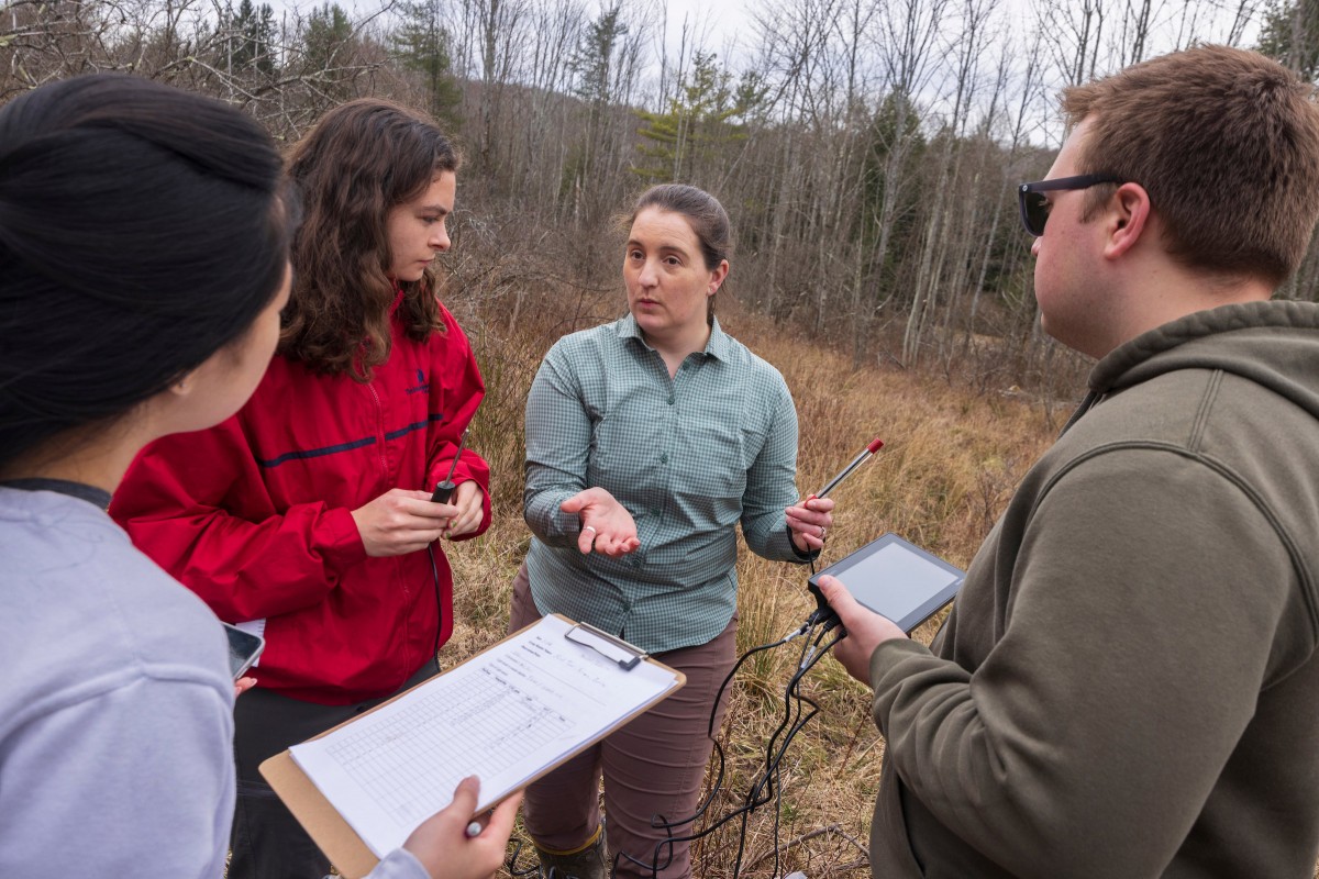 Assistant Professor of Ecosystem Science Amber Churchill instructs Jamila Wang, Tucker Keene and Arianna Edwards, part of her class ENVI 382B: Measuring the Natural World. On March 26, 2024, the class conducted an experiment at Nuthatch Hollow.
