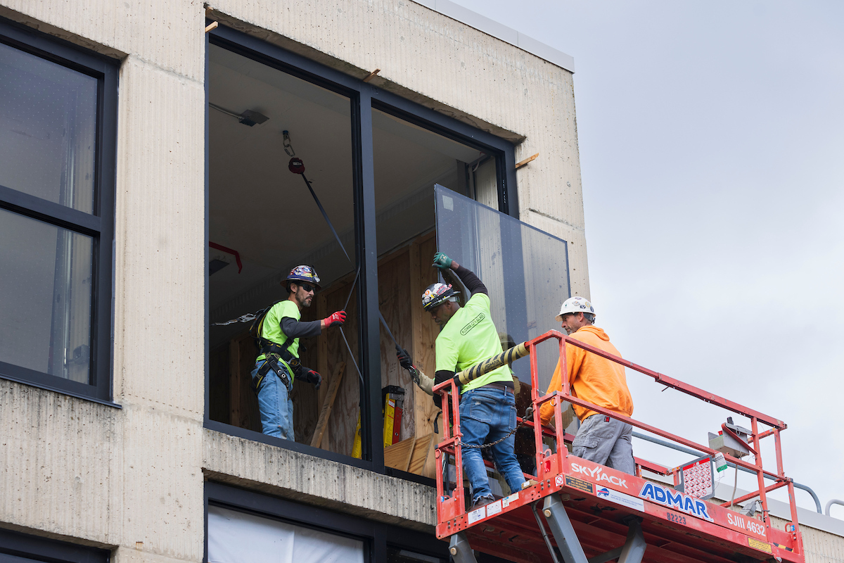 Work crews install bird-save windows at Science III on Sept. 24, 2024.