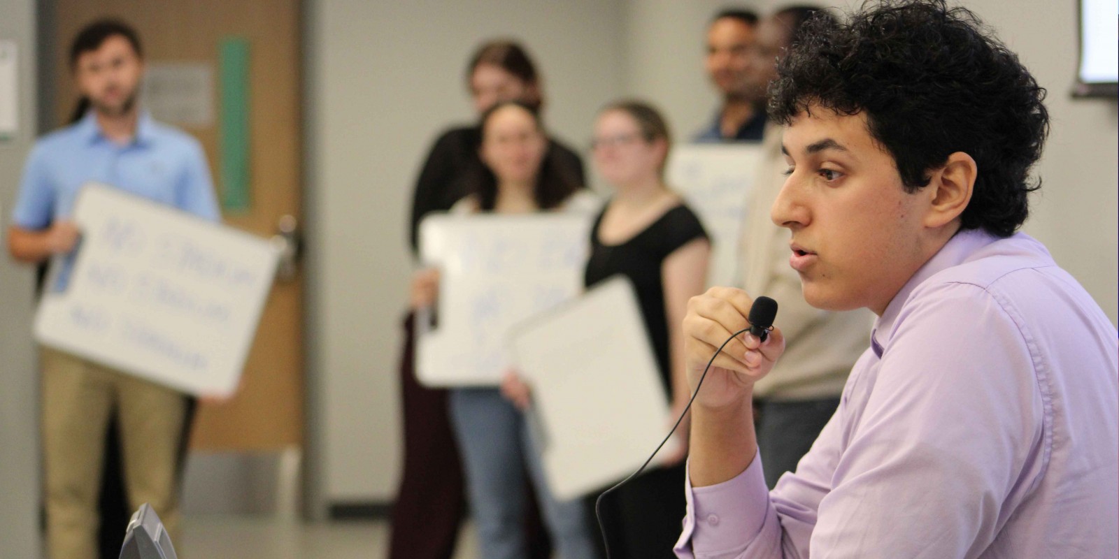 Mohamed Deumah, a second-year PharmD student, giving a press conference as the town's mayor during the emergency management simulation at the School of Pharmacy and Pharmaceutical Sciences.