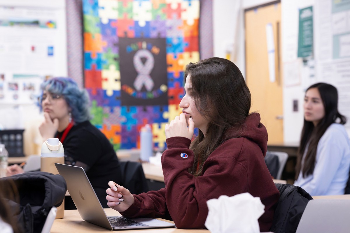 Distinguished Service Professor of Psychology Raymond G. Romanczyk teaches Psych 476: Society, Science and ASD at the Institute for Child Development, April 7, 2025. Pictured here, student Alana Brower listens.