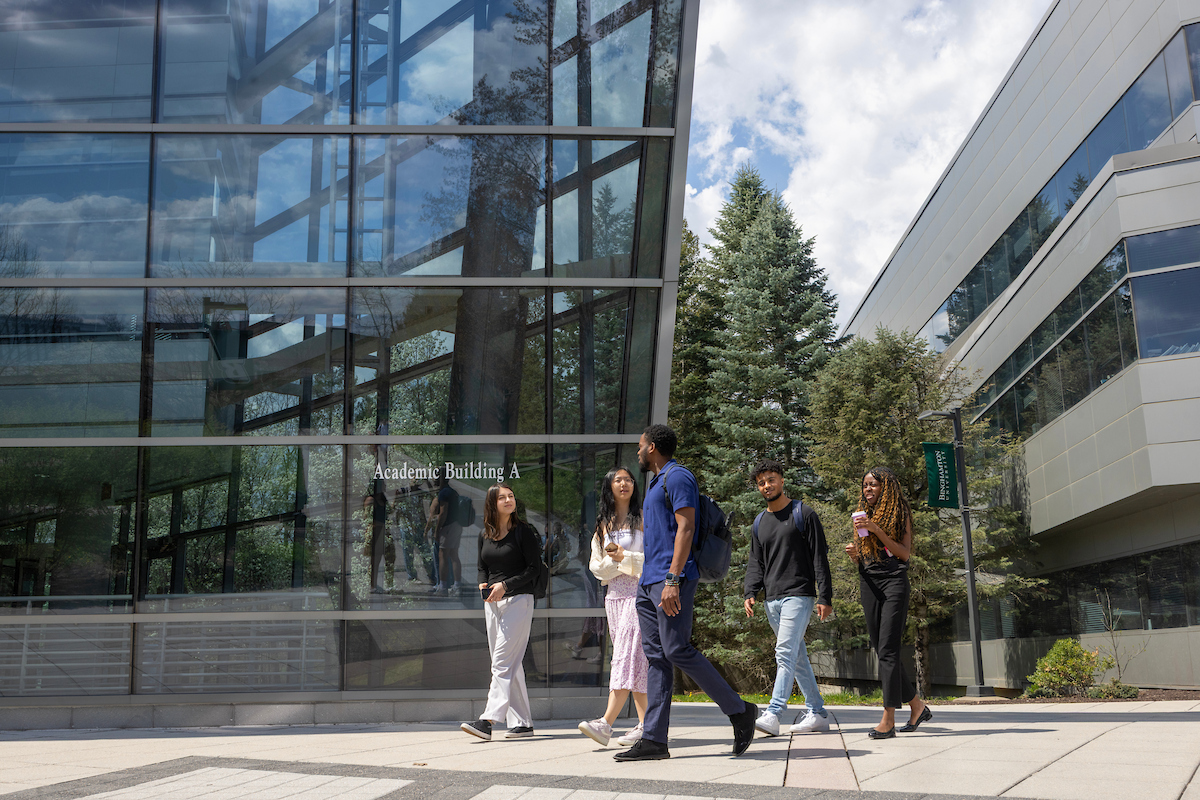 SOM students walk outside Academic Building A.