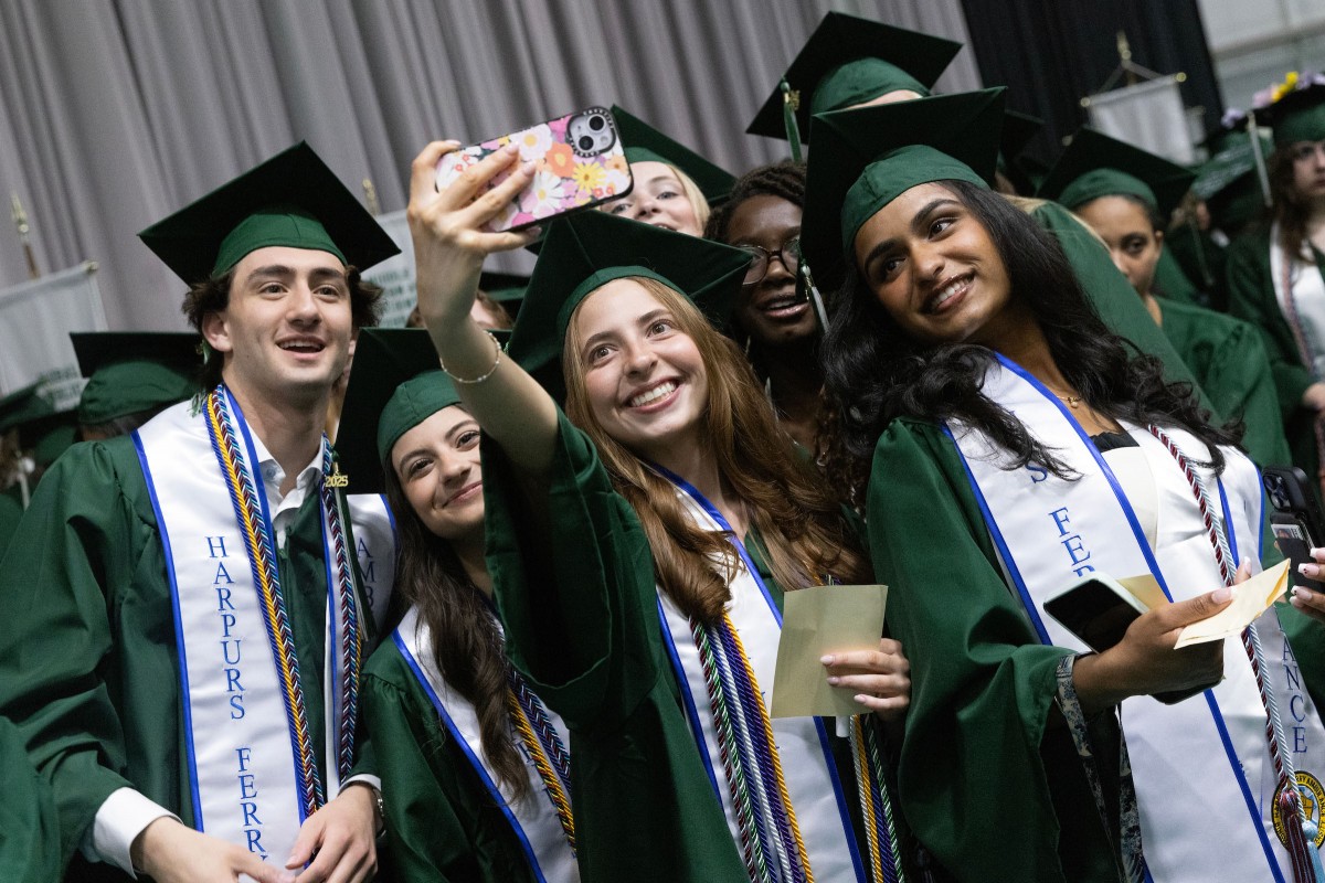Harpur College graduates strike a pose during the first Commencement ceremony on May 17, 2025.