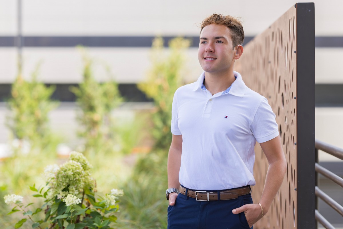 Political Science major Brett Patrick is a Harpur Fellow whose project helps provide hearing aids, hearing tests and fittings to individuals who cannot afford them. Patrick was photographed near the Glenn G. Bartle Library on September 16, 2025.