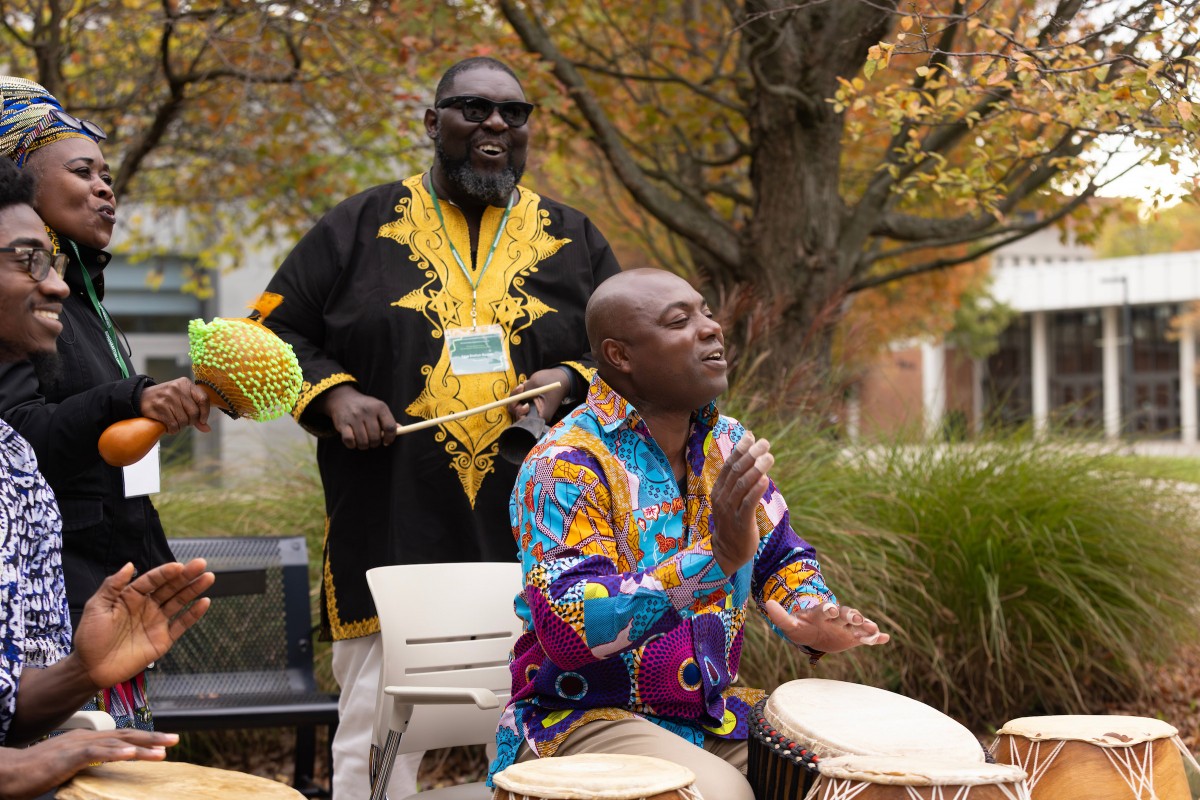 Assistant Professor of Theater and Africana Studies Samuel Elikem Nyuamuame, center, drums as students in the beginner African dance class perform the Ghanaian dance Kpanlogo during the opening of the Department of Africana Studies's third annual conference.