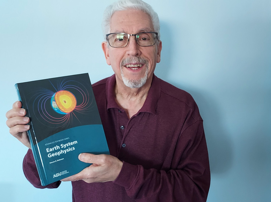 Professor Emeritus of Earth Sciences Steven Dickman and his new textbook, Earth System Geophysics.