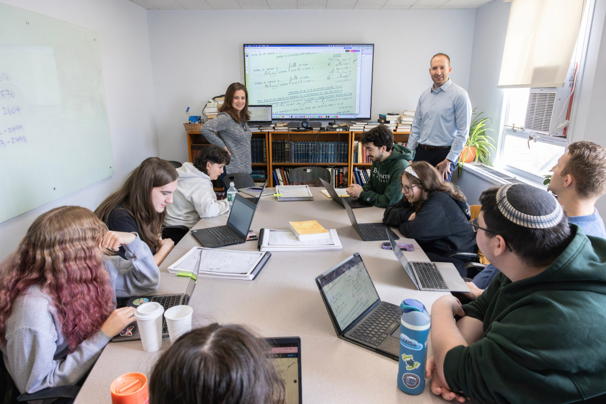 Associate Professor of Spanish and Linguistics Bryan Kirschen and Associate Professor of Judaic Studies and History Dina Danon co-teach a class in which students work with the organization JewishGen to transliterate family records written in Judeo-Spanish from Salonica, Greece (1934-1935). The group pictured here (from left) Anne-Marie Gabel, a first-year student majoring in Women, Gender and Sexuality Studies and history; Flora Brill, sophomore linguistics and Judaic Studies major; Erin Keating, a first-year linguistics major; Adina Steiner, a sophomore anthropology and Ancient Mediterranean Studies major; Danon; Kirschen; Marcos Guinazu, a first-year political science major; Leila Falkovsky, a first year biology and evolutionary studies major; Aaron Miller, a first-year Greek and Latin major; and Rafi Josselson, a first-year Judaic Studies and history major.