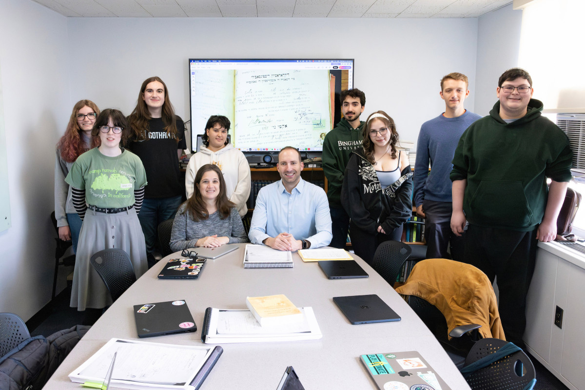 Associate Professor of Spanish and Linguistics Bryan Kirschen and Associate Professor of Judaic Studies and History Dina Danon co-teach a class in which students work with the organization JewishGen to transliterate family records written in Judeo-Spanish from Salonica, Greece (1934-1935). The group pictured here is meeting at the Glenn G. Bartle Library tower, April 21, 2026.