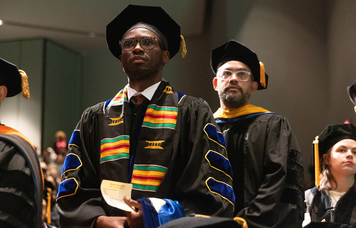 Doctoral candidates wait for their time onstage at the hooding ceremony on Thursday, May 14.