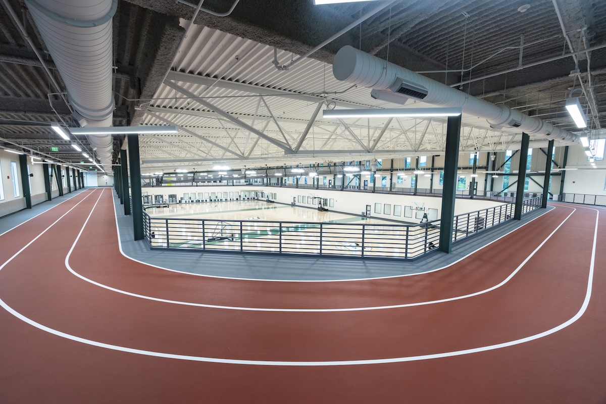 The East Gym's expansion includes a 200-meter indoor track.