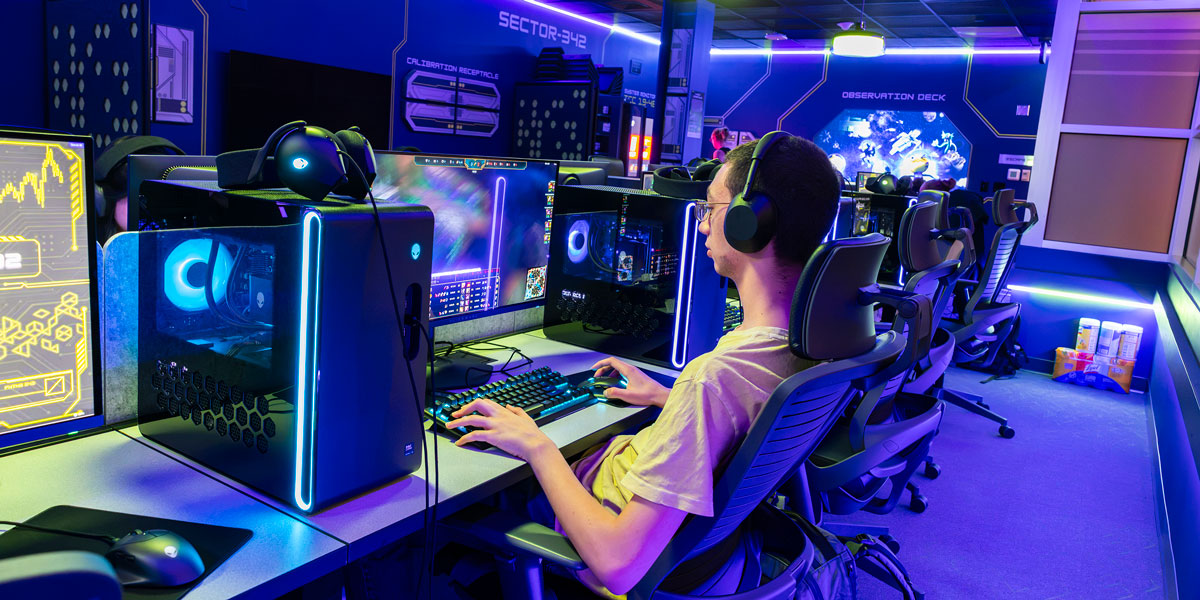 Kartik Wahlin plays League of Legends at the new space-themed gaming lounge at the Appalachian Collegiate Center at Mountainview College.