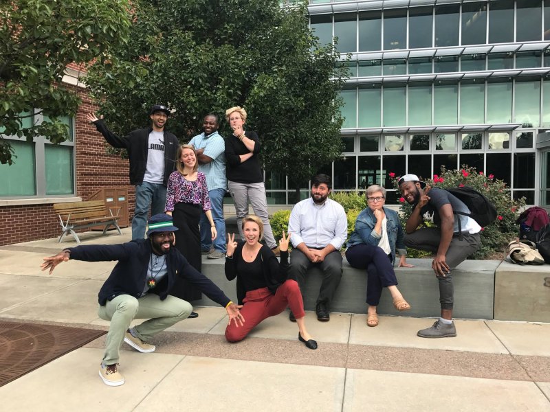 Justine Lewis, (standing, far right), with classmates in Community Research and Action PhD cohort.