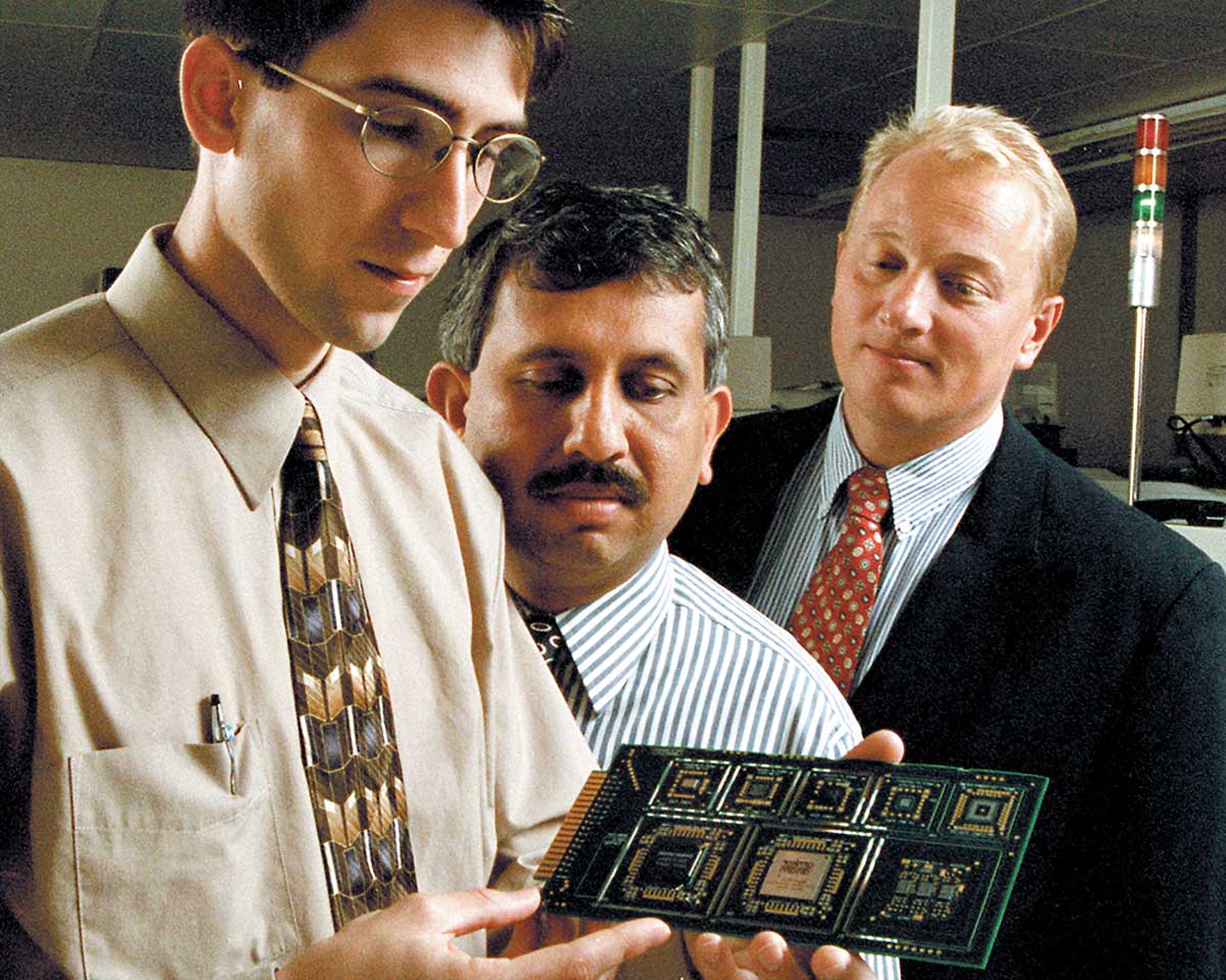 From left, Jeffrey Schake '96, MS '98, then-Professor Krishnaswami 