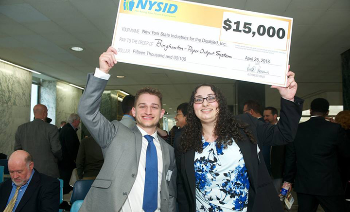 Two students who worked on the project, Jack Lucas and Natalie Zanco, accepting the grand prize.