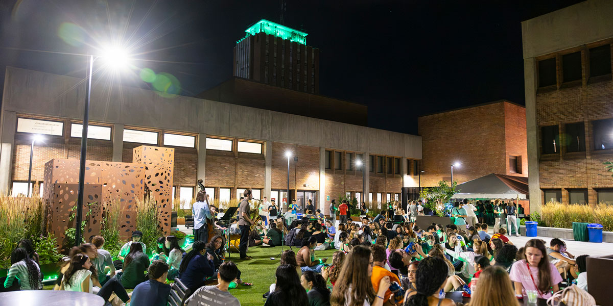 Students watched as the Library Tower glowed green, signifying the start of a new semester.